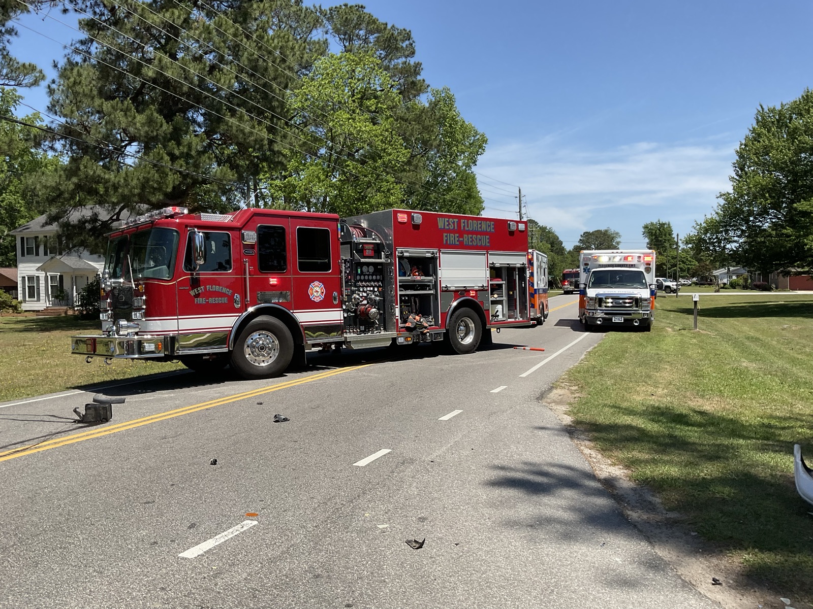 West Florence engine and ambulance staged on a residential street on a sunny day
